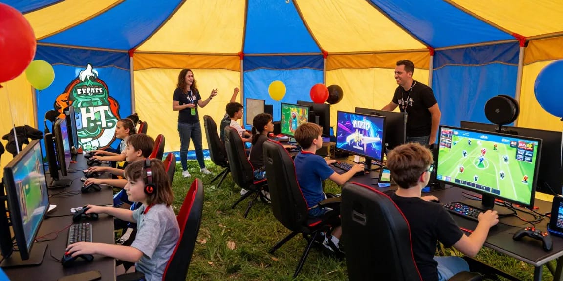 Exciting gaming party London setup with kids in a festive tent enjoying Fortnite tournaments.